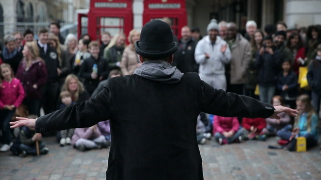 Street Artist in Front of Cheering Crowd in London