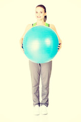 Healthy lifestyle woman with pilates exercise ball.