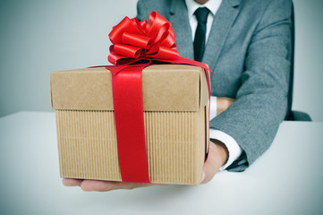 man in suit with a gift