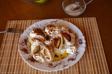 Delicious sweet dumplings with plum on a plate
