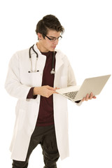 man doctor holding a laptop look at it