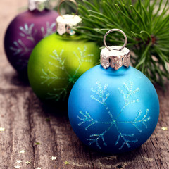 Christmas decoration ball on textured grungy wooden surface