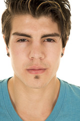 Obraz premium man in blue shirt head shot look serious