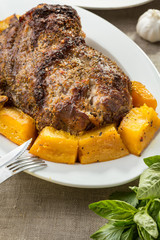 roastbeef with pumpkin pieces on white plate