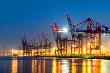 Container cranes in Hamburgs harbour at night