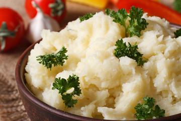 Delicious mashed potatoes in a bowl macro horizontal. rustic