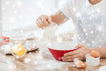 close up of man pouring milk to bowl