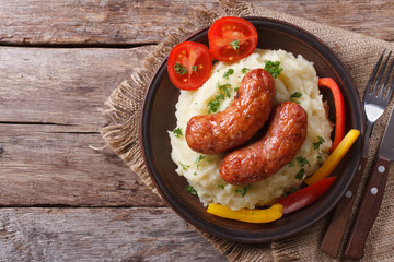 Grilled sausages and mashed potatoes, top view horizontal