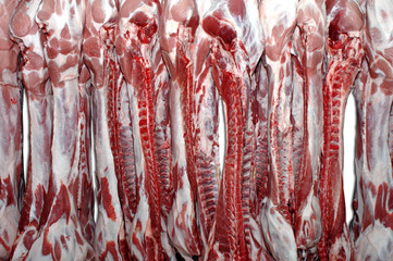 Pork carcases hanged in a butchery