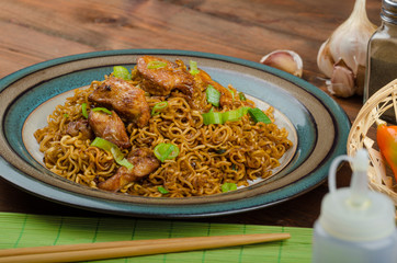 Chinese noodles with chicken and onion
