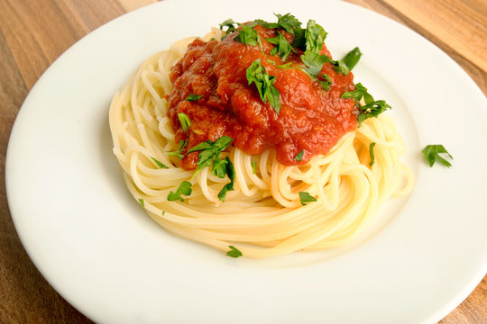 Spaghetti with tomato sauce and parsley