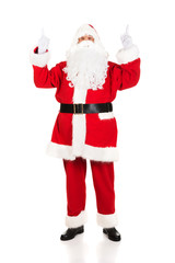 Full length Santa Claus pointing his hands up