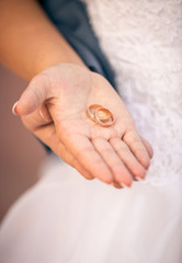 beautiful bride holding wedding ring on hand