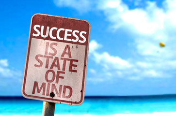 Success Is A State of Mind sign with a beach