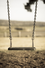 Playground swing at park with nobody