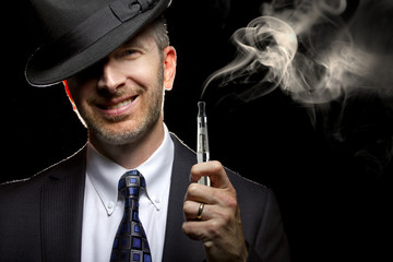 male smoking a vapor cigarette as an alternative to tobacco