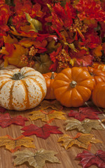 Colorful autumn leaves and pumpkins