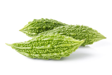 Green bitter gourds isolated on white.