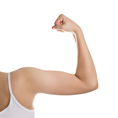 Woman showing her biceps isolated on white.