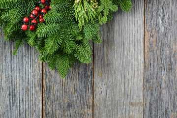 Tree branch with Holly Berry on rustic wooden background used fo