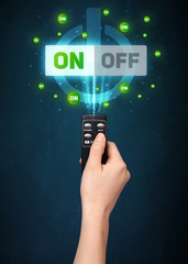Hand with remote control and on-off signals