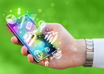 Smartphone with finance and market icons and symbols