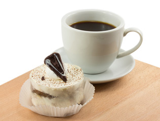 tiramisu and a cup of coffee on the board