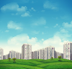 Fototapeta na wymiar High-rise buildings over green hills
