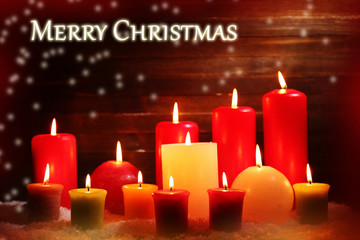 Burning candles on wooden background