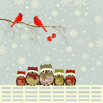 Christmas greeting card with family of owls on fence