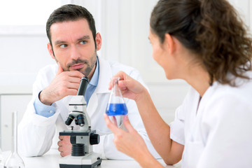 Scientist and her assistant in a laboratory