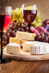 Cheese with a bottle and glasses of red wine