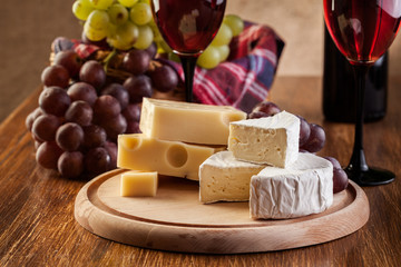 Cheese with a bottle and glasses of red wine