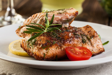 Fried salmon steak with vegetables