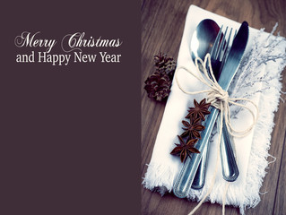Christmas table setting in silver, brown and white, copy space