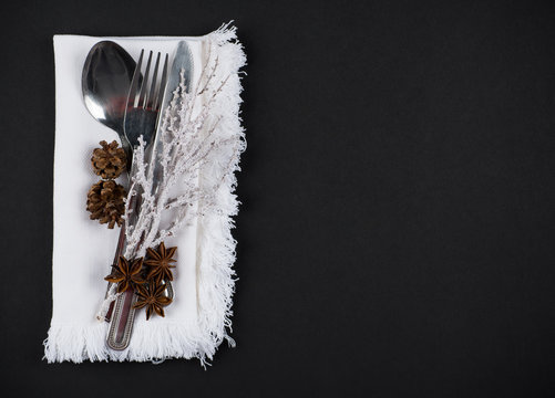 Christmas table setting in silver, brown and white, copy space