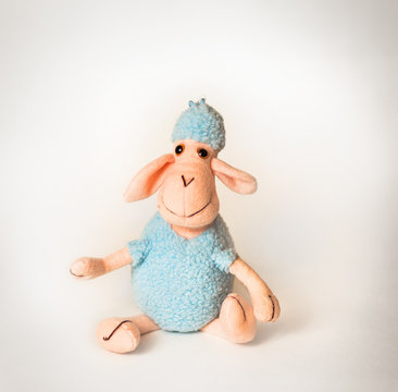 soft toy lamb on a white background
