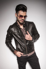 Fototapeta premium fashion man holding one hand in his pocket