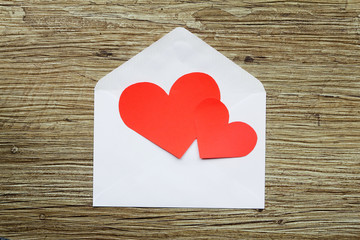 Two hearts on white envelope