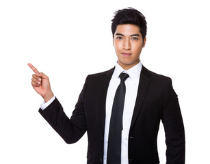 Businessman finger point up