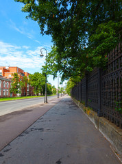 pavement and cast-iron fence