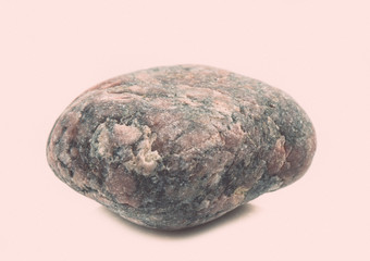 single stone isolated on white background. vintage