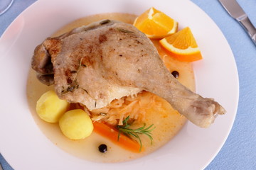 Duck leg with braised cabbage, potato and gravy