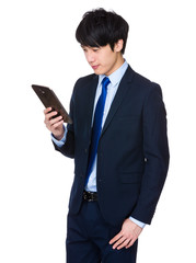 Businessman look at mobile phone