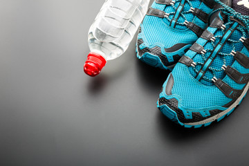 Sports runners and a bottle of water