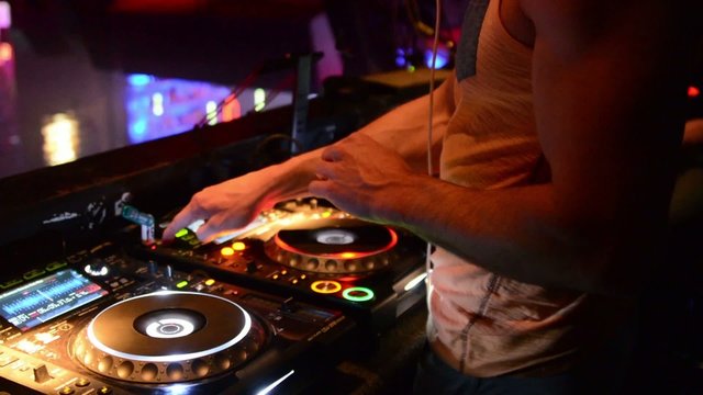 DJ at sound mixing work station