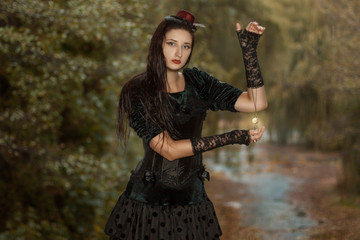 Girl holding the watch on a chain