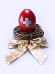 Egg painted red with a white cross