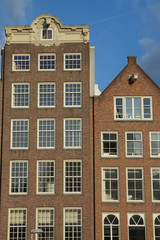 Fototapeta na wymiar The pair of historic houses in Amsterdam