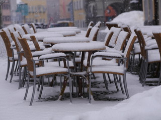 snowy chairs tables winter